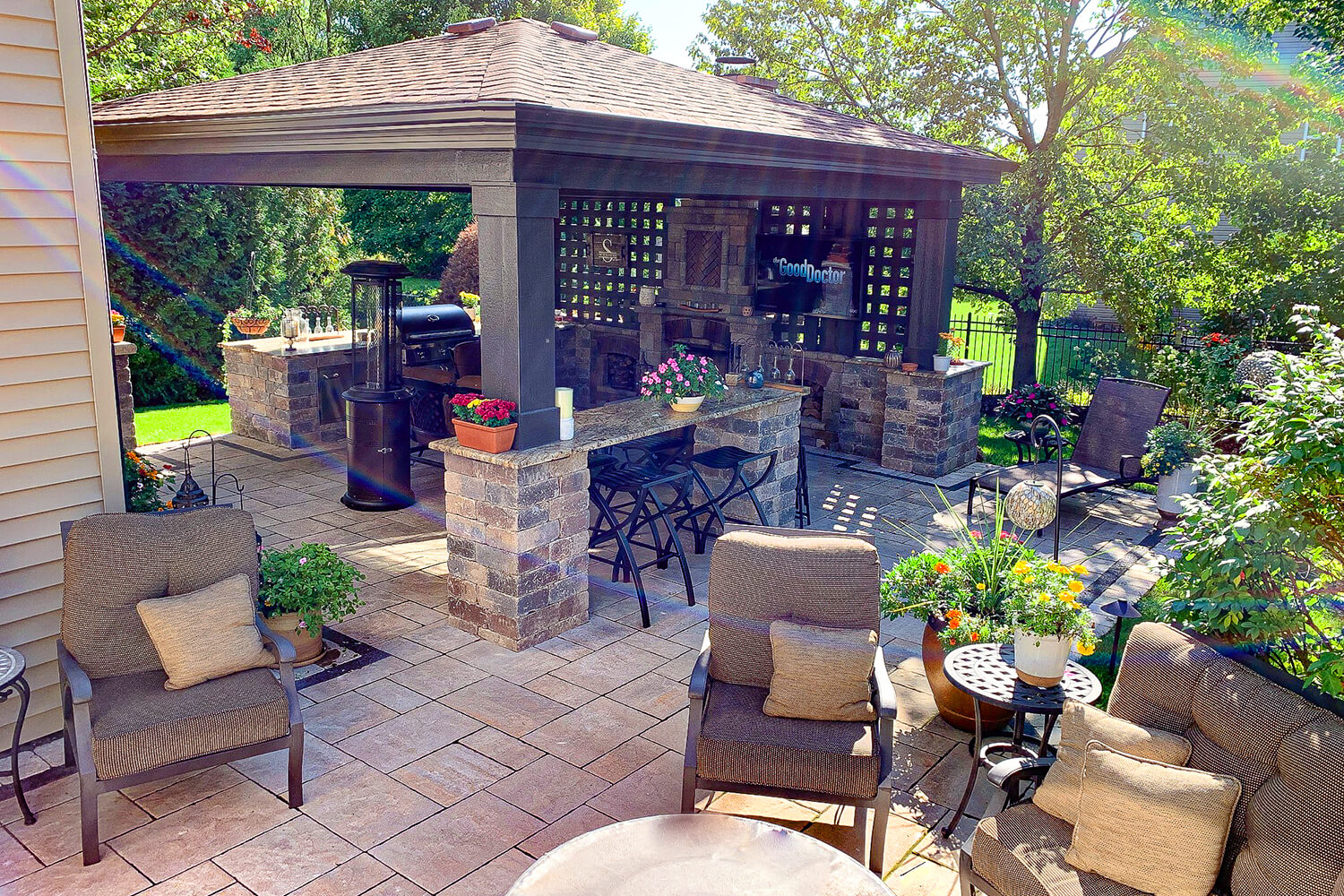 Outdoor Kitchen, Pergola, and Landscape Design by A Touch of Green