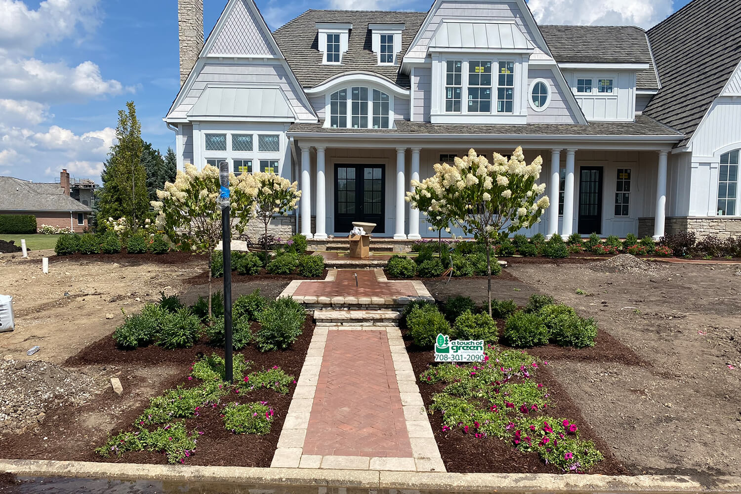 Design Transformation with Paver Walkway and Landscape Design by A Touch of Green