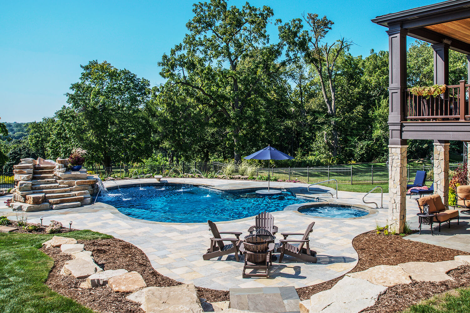 Design Transformation with Paver Pool Deck, Water Feature, and Landscape Design by A Touch of Green