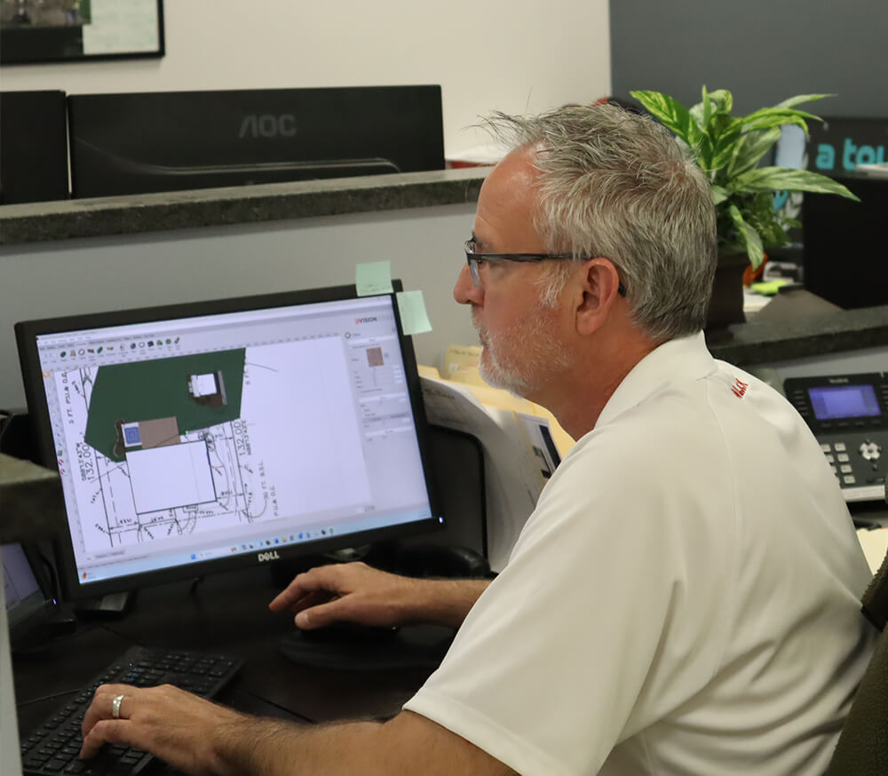 Gerry working on a landscape design at the A Touch of Green office