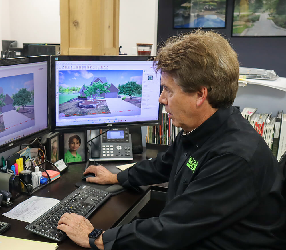 Gerry working on a landscape design at the A Touch of Green office