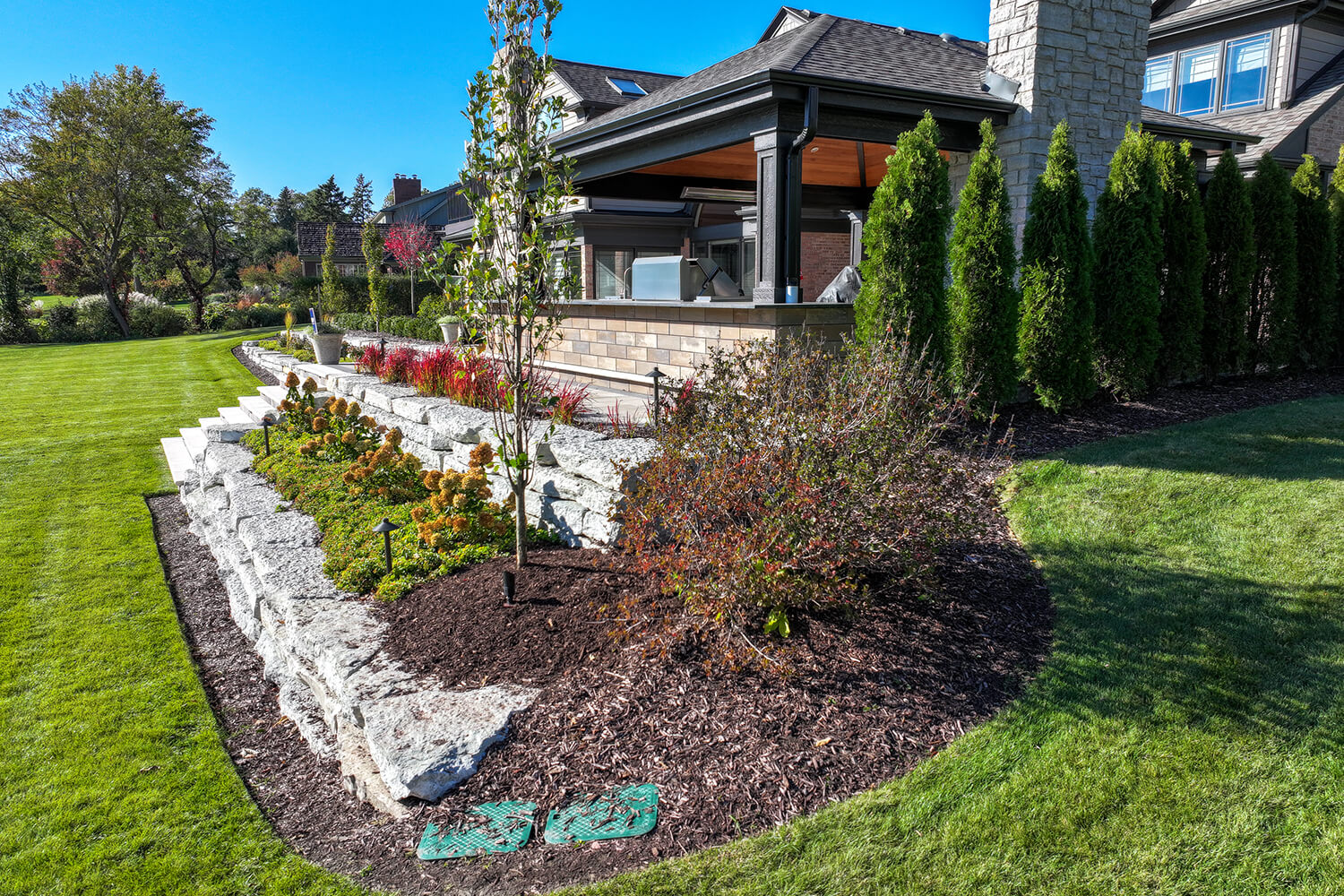 Landscape design and patio by A Touch of Green