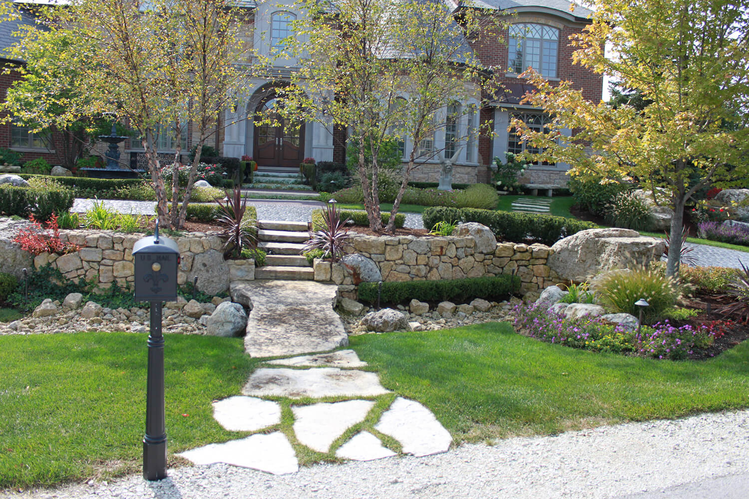 Paver Driveway and Landscape Design by A Touch of Green