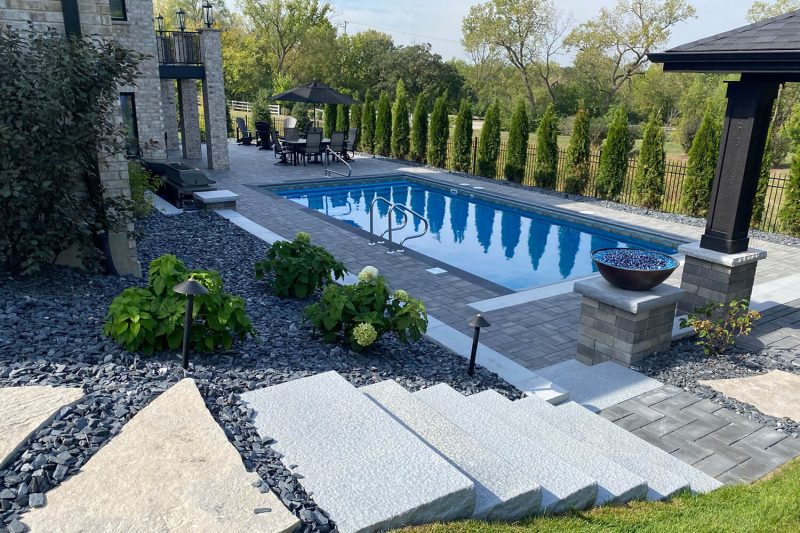 Paver Pool Patio and Landscape Design by A Touch of Green